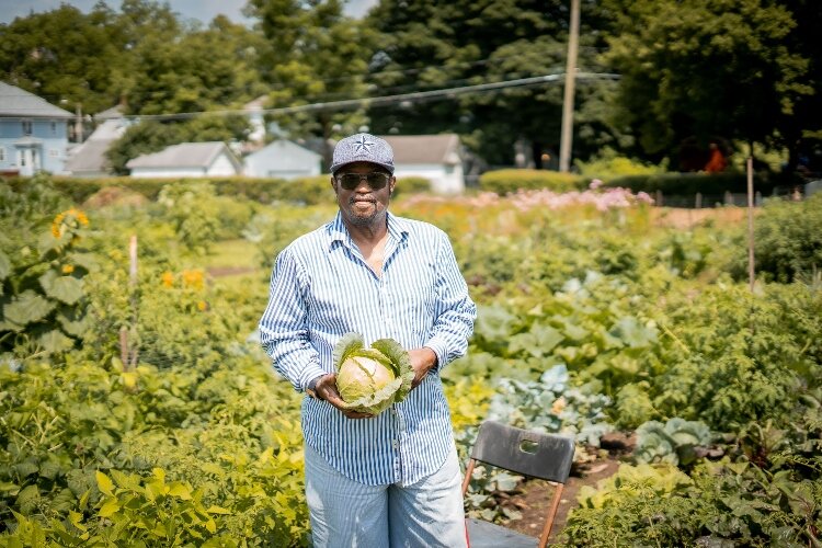 Ronel Muskeyvalley is one of the community gardeners at the Jefferson Street Oasis Garden. He works the largest plot in the garden and uses produce for services to deliver food to those in need within our community.
