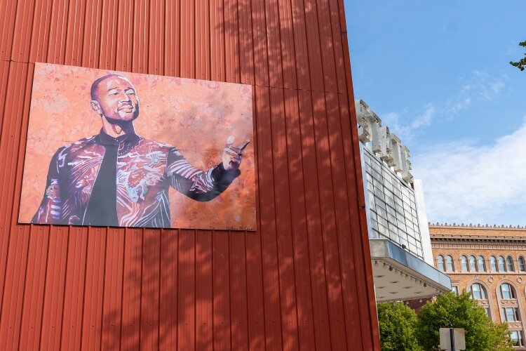 A mural on the side of the State Theatre features Springfield's own John Legend.